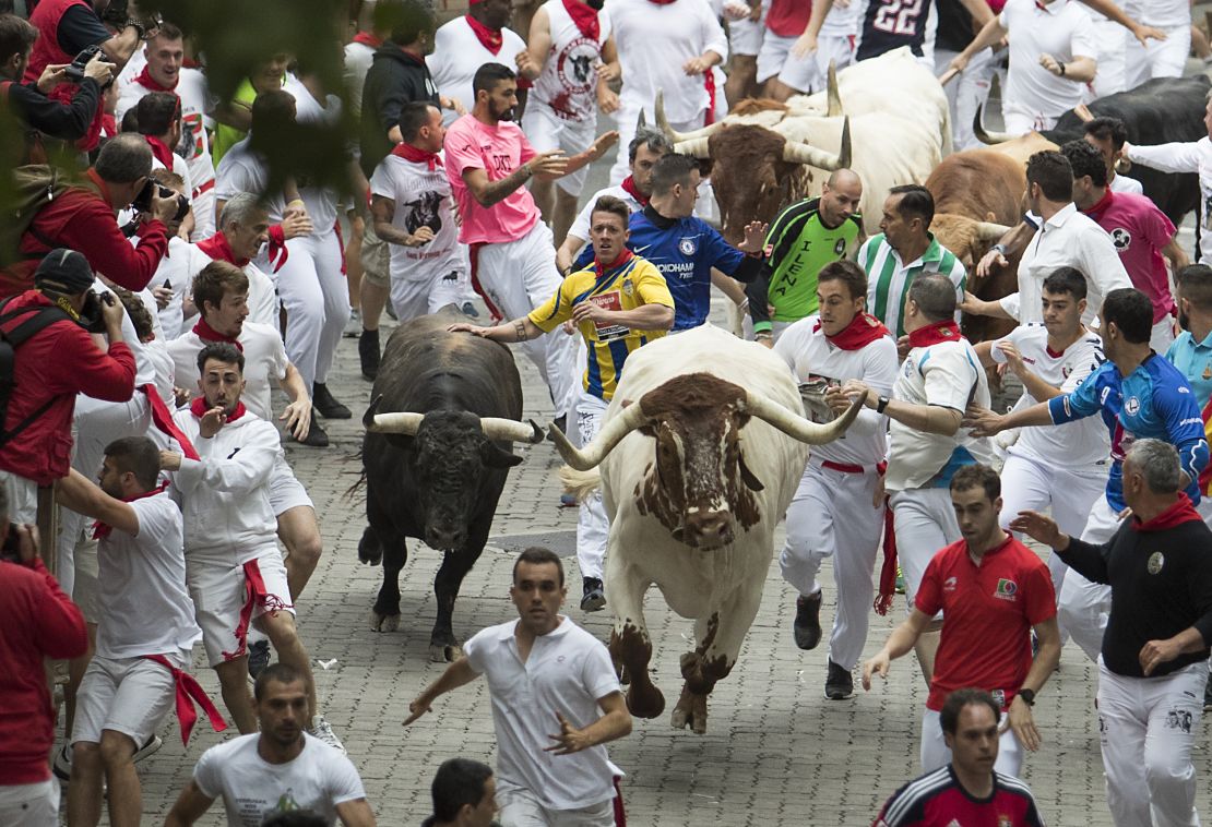 Spain: Three people gored in first Pamplona bull run