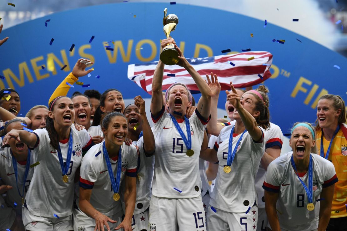 USWNT celebrate with the trophy after winning the 2019 Womens World Cup.