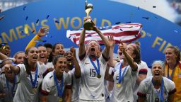 USA's players including forward Megan Rapinoe (C) celebrate with the trophy after the France 2019 Womens World Cup football final match between USA and the Netherlands, on July 7, 2019, at the Lyon Stadium in Lyon, central-eastern France. (Photo by FRANCK FIFE / AFP)        (Photo credit should read FRANCK FIFE/AFP/Getty Images)