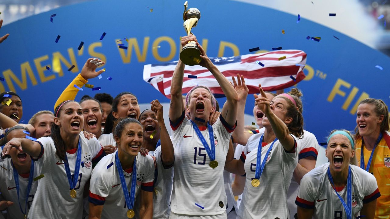 USWNT celebrate with the trophy after winning the 2019 Womens World Cup.