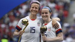 United States' forward Megan Rapinoe poses with the Golden Ball next to United States' midfielder Rose Lavelle with the Bronze Ball after the France 2019 Womens World Cup football final match between USA and the Netherlands, on July 7, 2019, at the Lyon Stadium in Lyon, central-eastern France. (Photo by CHRISTOPHE SIMON / AFP) / The erroneous mention[s] appearing in the metadata of this photo by CHRISTOPHE SIMON has been modified in AFP systems in the following manner: [Bronze Ball] instead of [Silver Ball]. Please immediately remove the erroneous mention[s] from all your online services and delete it (them) from your servers. If you have been authorized by AFP to distribute it (them) to third parties, please ensure that the same actions are carried out by them. Failure to promptly comply with these instructions will entail liability on your part for any continued or post notification usage. Therefore we thank you very much for all your attention and prompt action. We are sorry for the inconvenience this notification may cause and remain at your disposal for any further information you may require.        (Photo credit should read CHRISTOPHE SIMON/AFP/Getty Images)