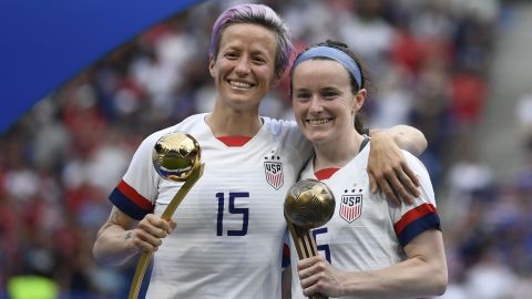 Megan Rapinoe poses with the Golden Ball next to Rose Lavelle with the Bronze Ball.