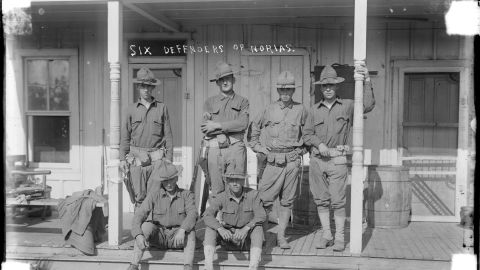 United States soldiers deployed to the US-Mexico border during The Massacre era pose for a photo.