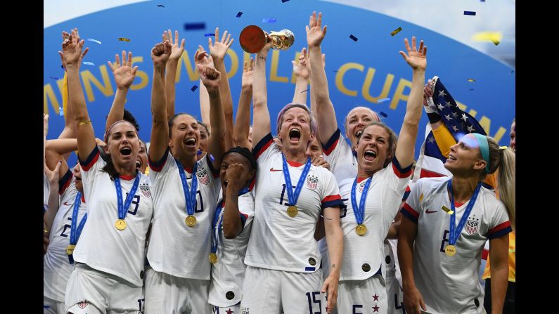 US captain Megan Rapinoe lifts the <a href="index.php?page=&url=https%3A%2F%2Fwww.cnn.com%2F2019%2F07%2F07%2Ffootball%2Fgallery%2Fwomens-world-cup-final-us-netherlands%2Findex.html" target="_blank">World Cup</a> trophy after the United States defeated the Netherlands 2-0 in the World Cup Final in Lyon, France on Sunday, July 7. This is the second straight World Cup title for the US team and fourth overall -- two more than any other country.