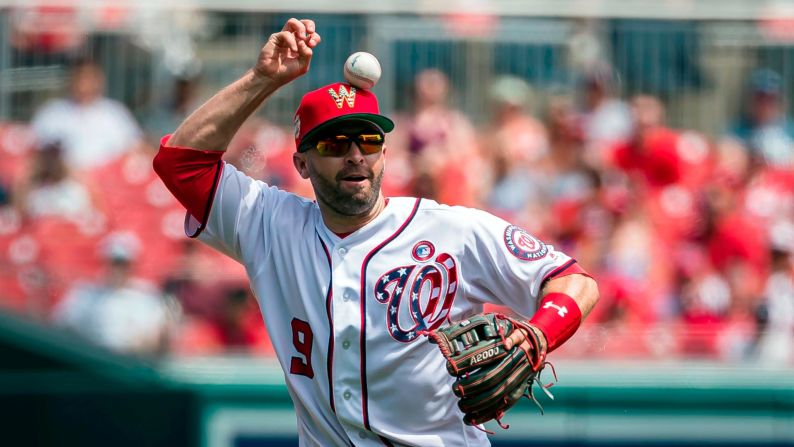 Washington Nationals second baseman Brian Dozier mishandles a ground ball during a baseball game against the Miami Marlins at Nationals Park in Washington, DC, on Thursday, July 4.