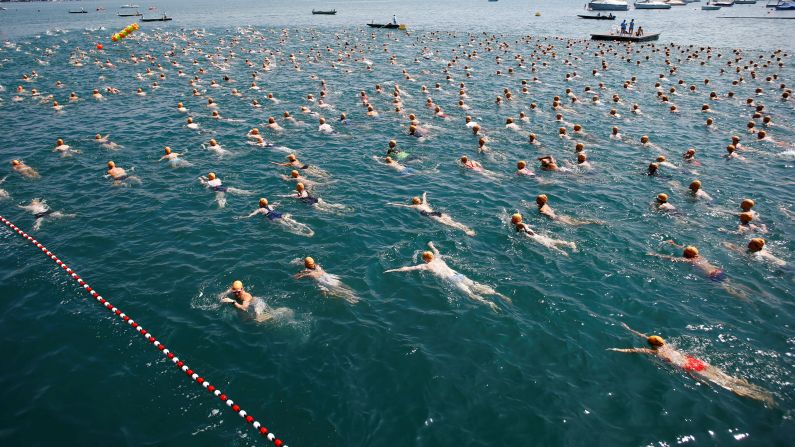 Swimmers participate in the annual Lake Zurich crossing in Zurich, Switzerland, on July 3.