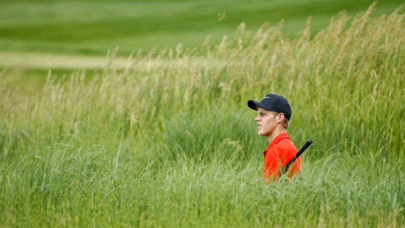 Cameron Davis stands in a bunker at the 9th hole during the first round of the 3M Championship golf tournament at TPC Twin Cities in Blaine, Minnesota, on Thursday, July 4.