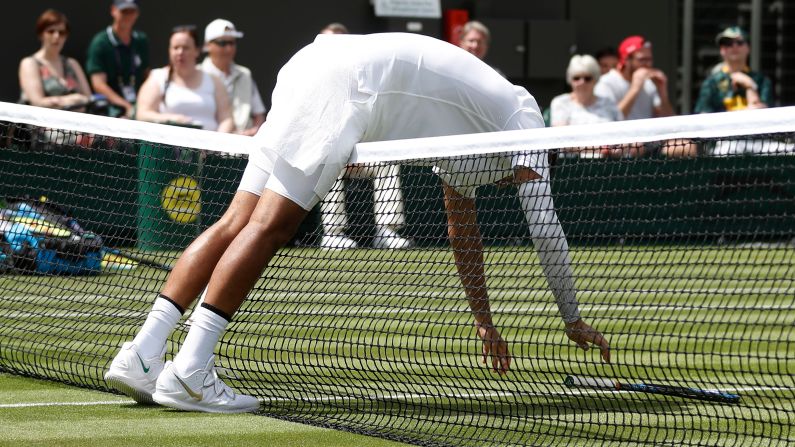 Australia's Nick Kyrgios bends over the net during his first round singles match against Australia's Jordan Thompson at Wimbledon in London, England, on Tuesday, July 2.