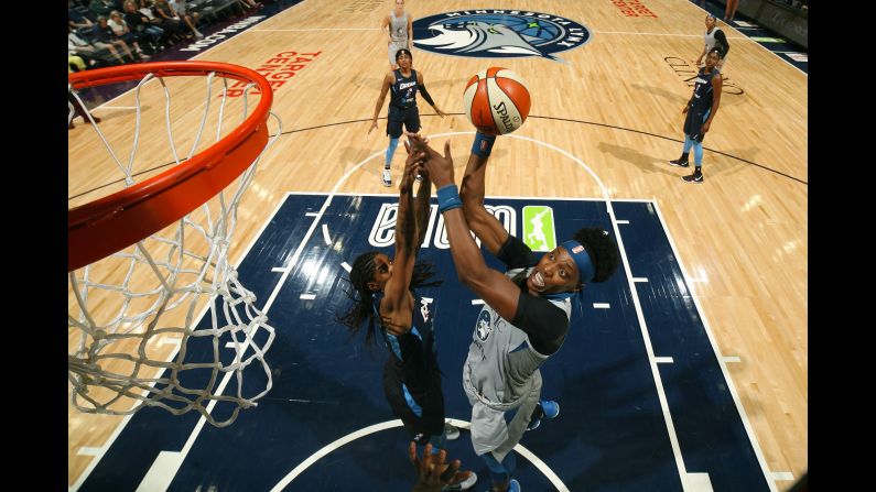 Sylvia Fowles of the Minnesota Lynx, right, drives to the basket during a WNBA game against the Atlanta Dream in Minneapolis, Minnesota, on July 2.