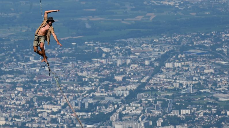 A man walks on a slackline during the 7th edition of the European Marmotte Highline Project festival in Lans-en-Vercors, France, on July 4.