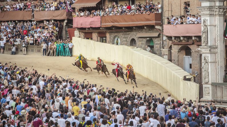 Jockeys compete at the historical horse race Palio di Siena in Siena, Italy, on Tuesday, July 2.