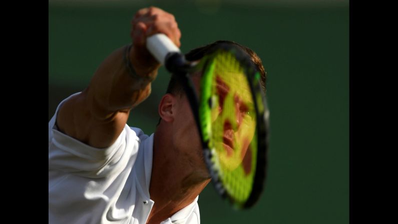 Marton Fucsovics of Hungary competes during his Wimbledon second round match against Fabio Fognini of Italy at the All England Lawn Tennis and Croquet Club in London, England, on Thursday, July 4.
