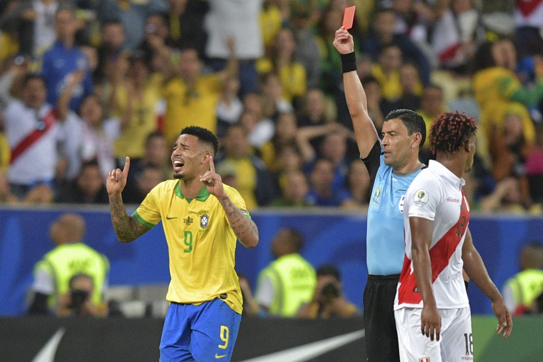 Chilean referee Roberto Tobar shows the red card to Brazil's Gabriel Jesus.