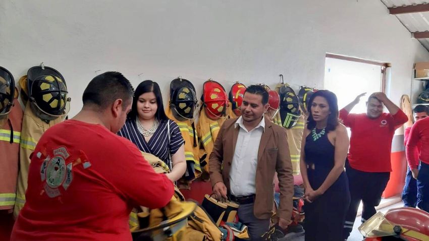 Kim Lopez, second from left, and her family arrive in Degollado, Mexico, with nearly $90,000-worth of donated firefighting gear.