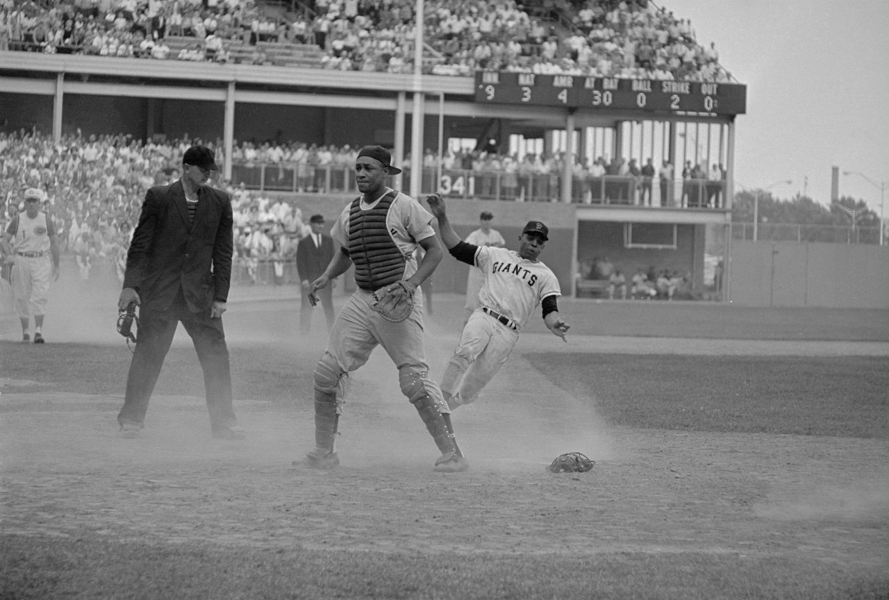 Willie Mays slides into home during the 1964 All-Star Game at New York's Shea Stadium. Mays holds the career record for most All-Star hits (23) and stolen bases (six).