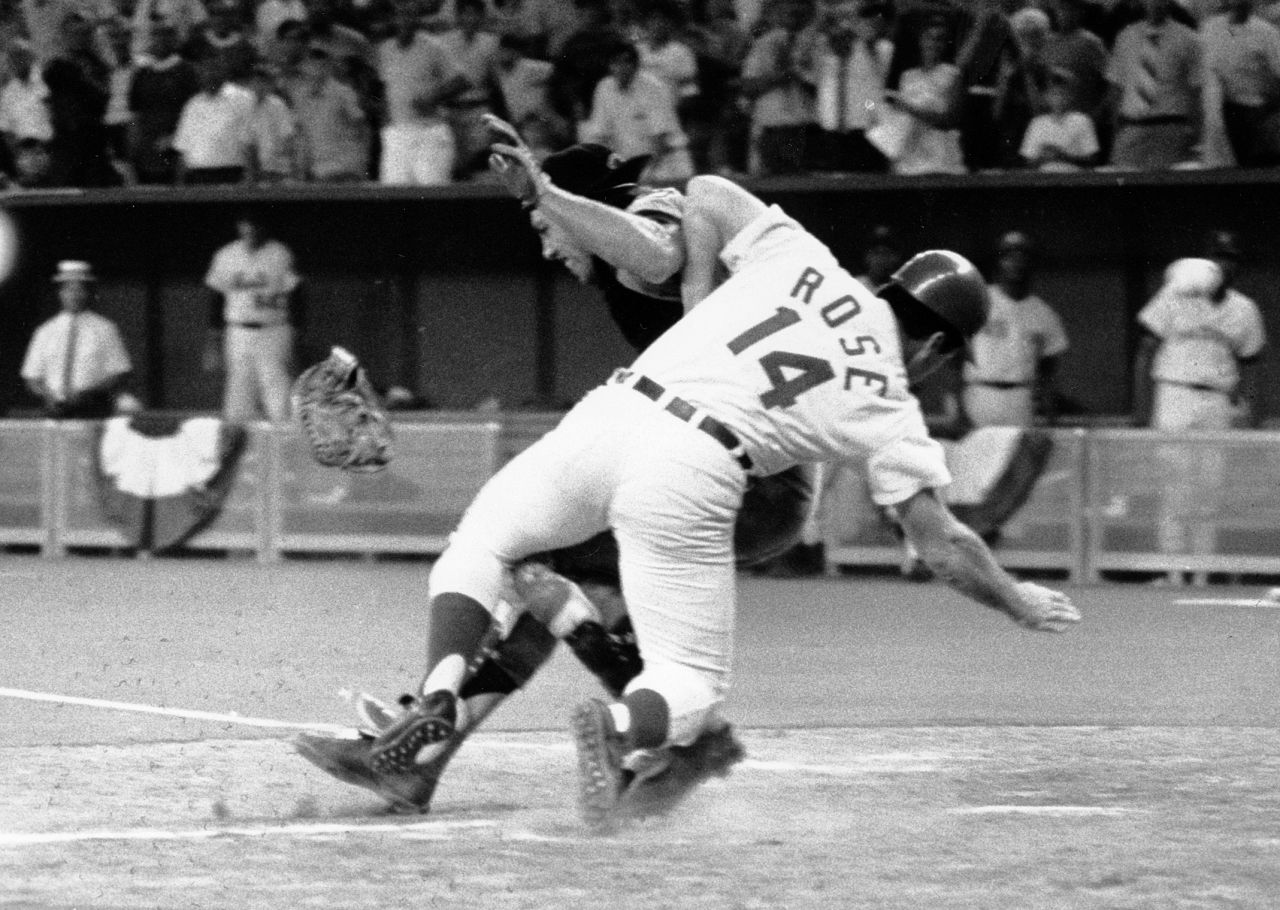 Pete Rose collides with catcher Ray Fosse as he scores the winning run in the 12th inning of the 1970 All-Star Game. Both players were injured. Rose was criticized by some for playing so aggressively in an exhibition game.