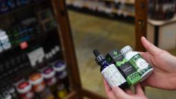 BOULDER, CO - DECEMBER 4: Sarah Shebanek, wellness buyer for  Alfalfa's, works with the CBD oil supplements the store sells on December 4, 2017 in Boulder, Colorado. (Photo by RJ Sangosti/The Denver Post via Getty Images)