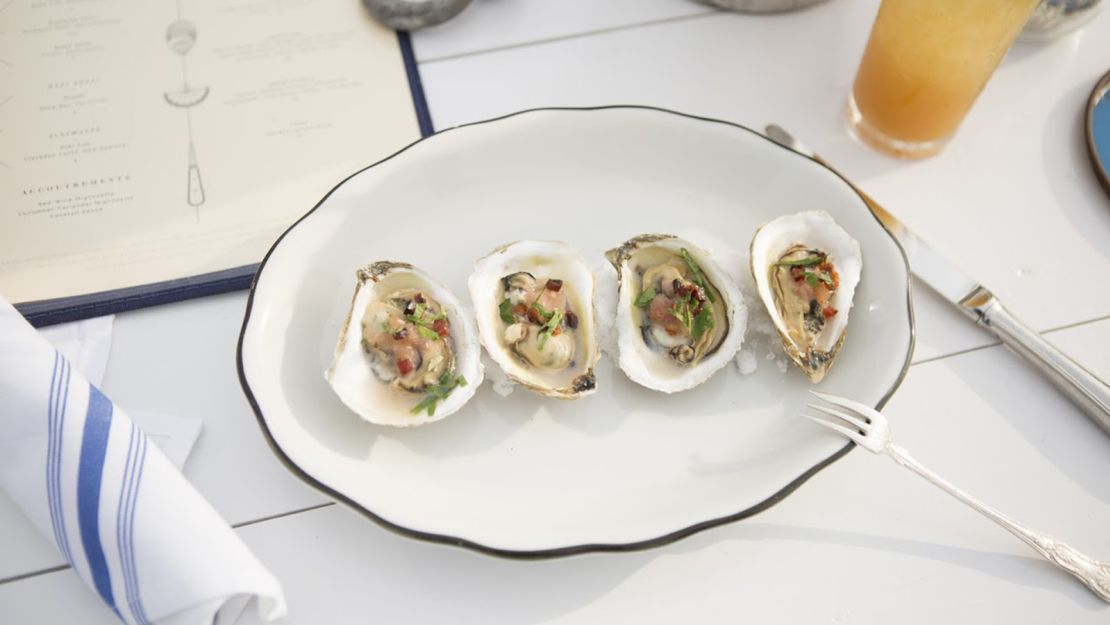 The floating New York City oyster bar offers creative oyster preparations to enjoy with the view. 