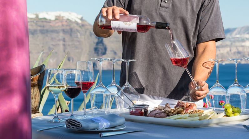 <strong>Lycabettus (Santorini, Greece): </strong>Watching the famous Santorini sunsets is enhanced when paired with a local wine tasting. 