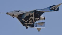 Virgin Galactic's VSS Unity comes in for a landing after its suborbital test flight on December 13, 2018, in Mojave, California. - Virgin Galactic marked a major milestone on Thursday as its spaceship made it to a peak height, or apogee, of 51.4 miles (82.7 kilometers), after taking off attached to an airplane from Mojave, California, then firing its rocket motors to reach new heights. (Photo by Gene Blevins / AFP)        (Photo credit should read GENE BLEVINS/AFP/Getty Images)