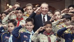 Texas billionaires H. Ross Perot gives the Boy Scout salute with New York are scouts prior to an awards luncheon on Friday, June 8, 1990 in New York where he received the 1990 Boy Scouts of America Award for Courage. Perot credits his scouting experience for his rise to fortune and has donated millions to the organization in the past. (AP Photo/Marty Lederhandler)