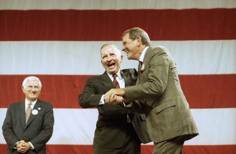 Perot shakes hands with actor Richard Crenna after speaking at a rally in Long Beach, California, in November 1992.