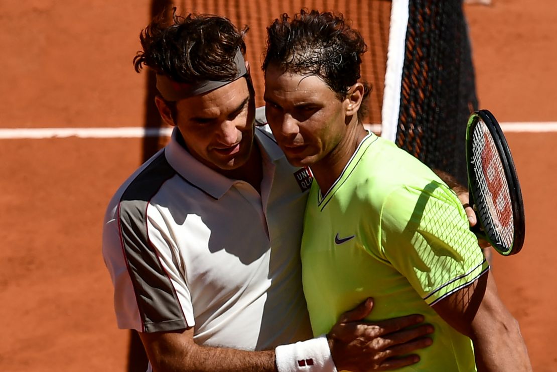 Roger Federer and Rafael Nadal embrace after their French Open semifinal Nadal won. 