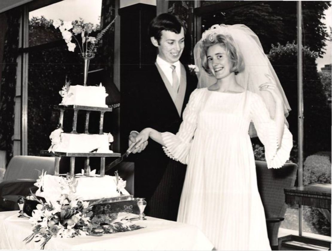 Norman and Leila Riddell cut the cake on their wedding day.