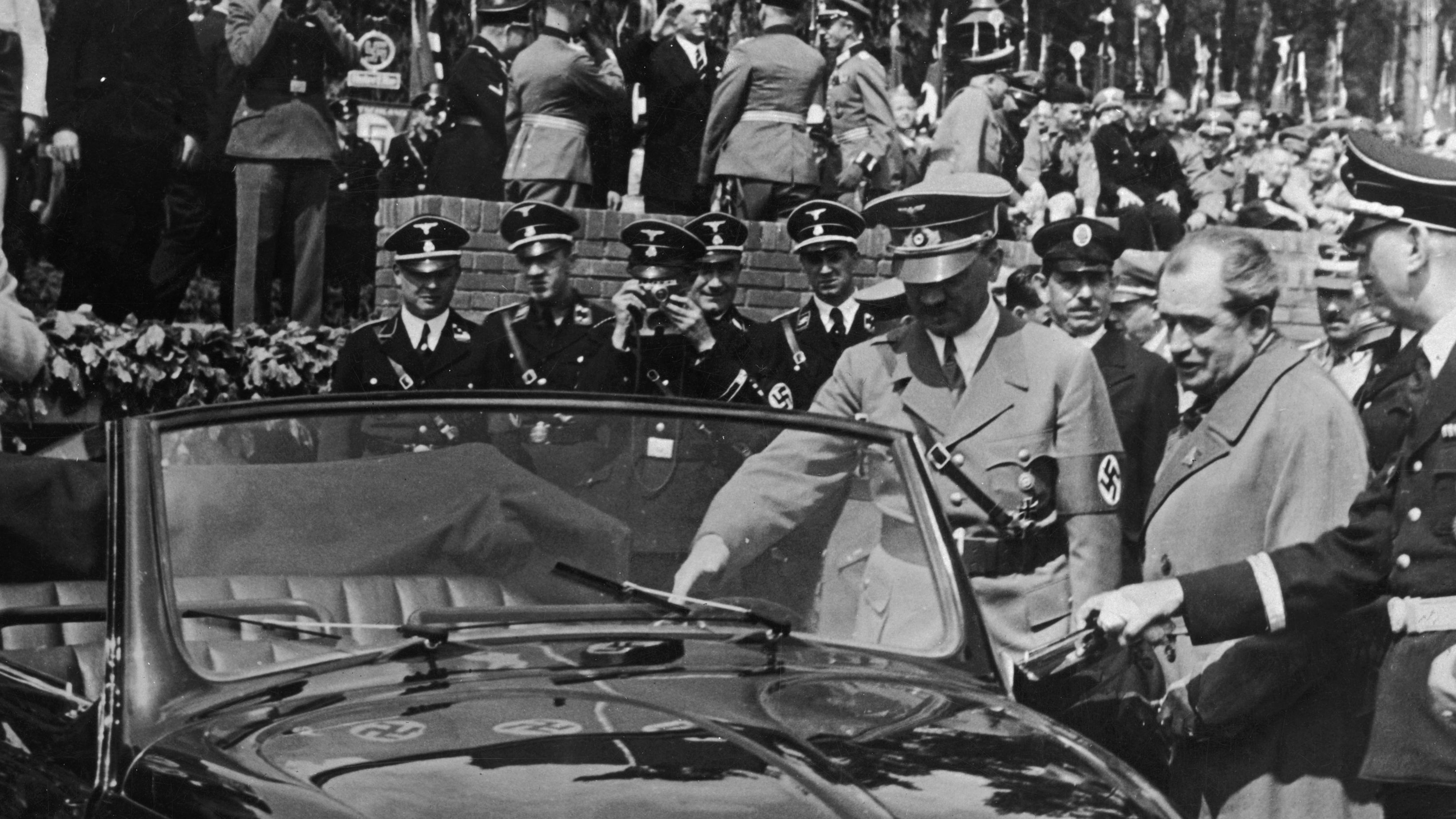 Ferdinand Porsche presents a new convertible version of the KdF-Wagen to Nazi leader Adolph Hitler in 1938. KdF stood for "Kraft durch Freude" or "strength through joy." Designed to be affordable and easy to operate for ordinary Germans, it was more popularly known as the "people's car," or "Volkswagen."