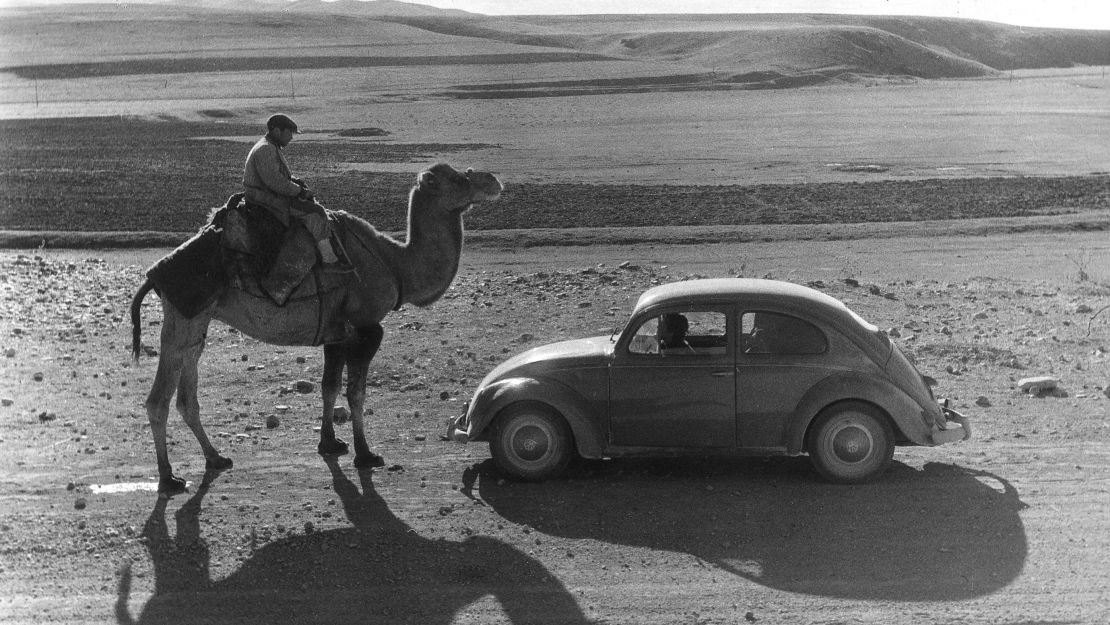 A man riding a camel in Turkey encounters a Beetle on the road from Istanbul and Ankara.