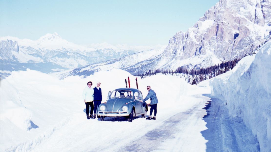 With the engine located in the back, the rear wheels powered the car forward, giving the Beetle excellent traction in difficult conditions. Here, skiers are getting into their Volkswagen Beetle in the Swiss Alps.