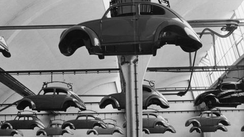 Beetle bodies being carried over the production line in 1965. Later, they would be lowered down onto the cars' chassis.