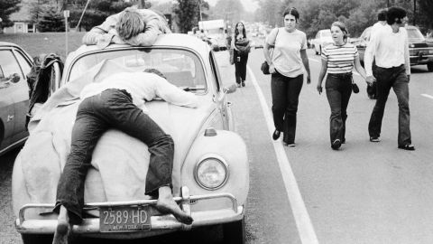 The Beetle, along with the Volkswagen bus, became synonymous with the hippie movement in the 1960s and '70s. Here, a couple of attendees at the 1969 Woodstock music festival take a nap on a Beetle. 