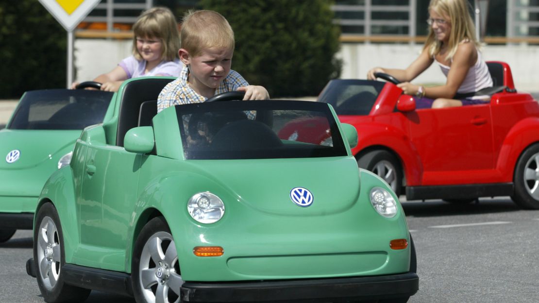 Next to Volkswagen's factory in Wolfsburg, Germany, is the Autostadt, a visitor center that features a museum, an off-road driving course, restaurants, a cinema and a test track for kids. Here, children drive electric-powered toy Beetles in order to receive a "children's driving license."