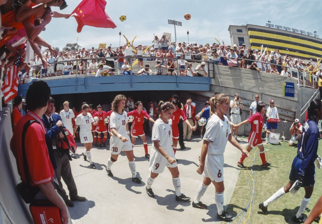 Members of the USA and China national teams enter the field prior to the final game of the 1999 FIFA Women's World Cup at the Rose Bowl in Pasadena, California.  