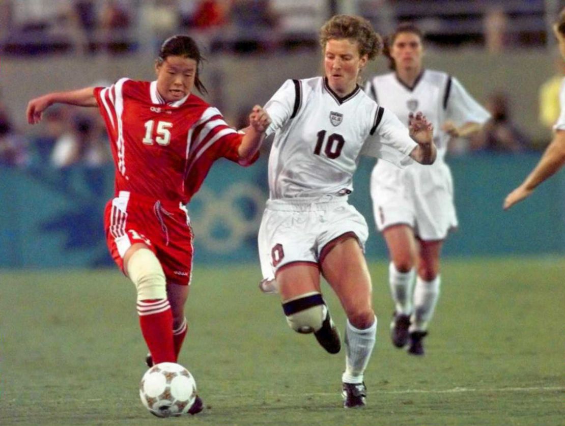  Michelle Akers and China's Guihong Shi fight for the ball during women's Olympic soccer finals in 1996.