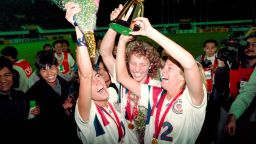 Michelle Akers-Stahl (C) who scored two goals for the US to win the first FIFA World Championship for Women's Football on November 30, 1991, holds the trophy together with teammates Julie Foudy (L) and Carin Jennings (R). The US won the championship by beating Norway 2-1. The FIFA Women's World Cup is recognized as the most important International competition in women's football and is played amongst women's national football teams of the member states of FIFA. Contested every four years, the first Women's World Cup tournament, named the Women's World Championship, was held in 1991, sixty-one years after the men's first FIFA World Cup tournament in 1930AFP PHOTO TOMMY CHENG (Photo by TOMMY CHENG / AFP)        (Photo credit should read TOMMY CHENG/AFP/Getty Images)