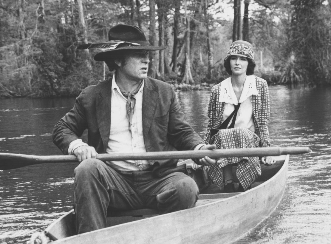 Actors Rip Torn and Mary Steenburgen in a rowing boat, in a scene from the movie 'Cross Creek', 1983.