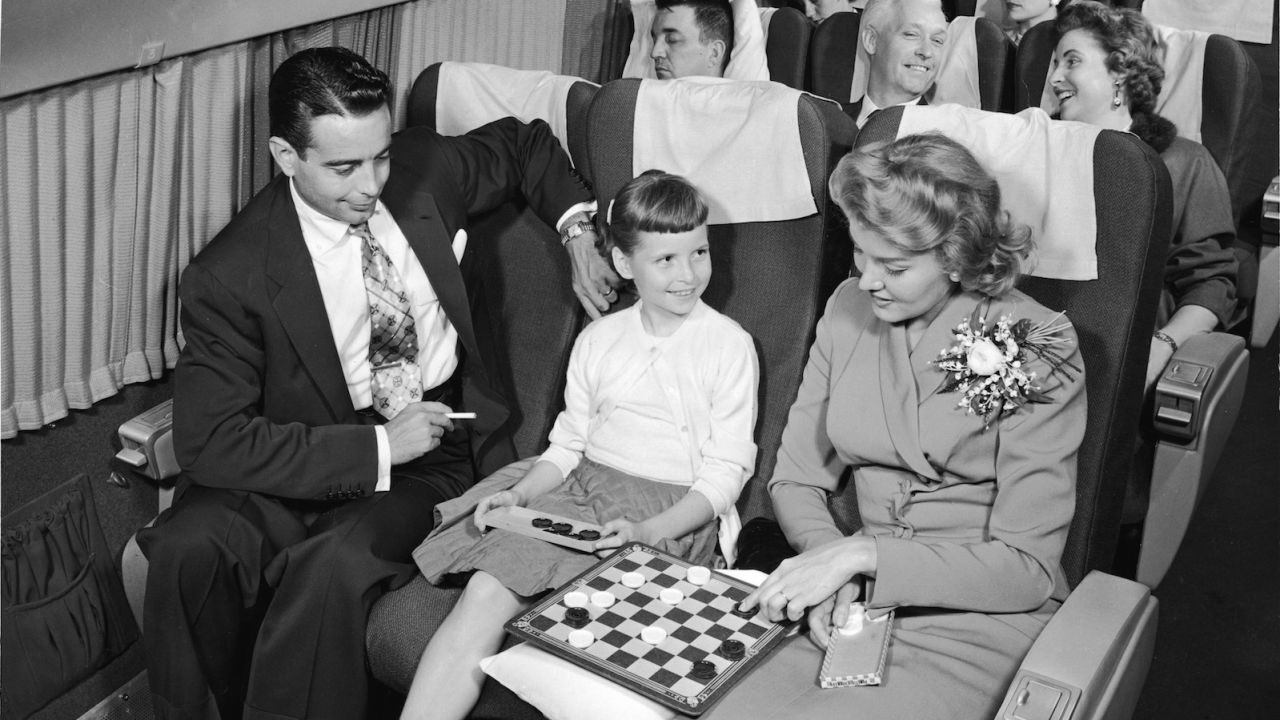 We've come a long way, baby. In the 1950s, inflight entertainment meant checkers and cigarettes.  