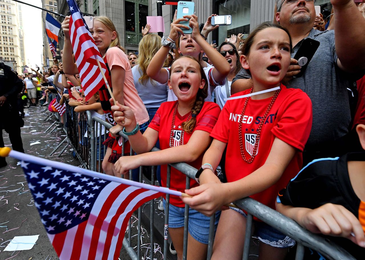 Fans cheer during the Women's World Cup championship parade.