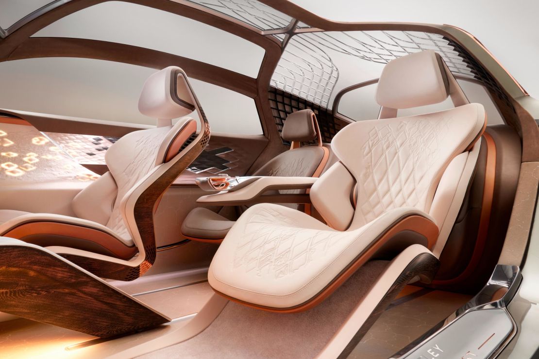 A digital rendering shows the EXP 100 GT's interior.