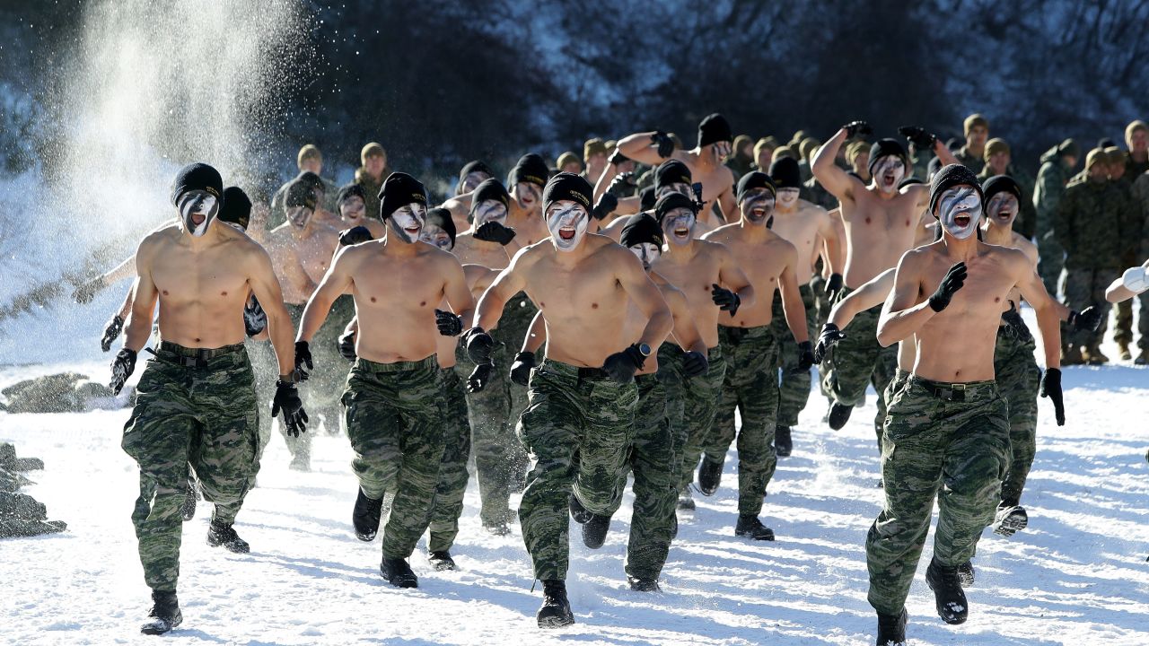 South Korean marines participate in winter endurance exercises. The country's military fosters a hypermasculine attitude among its mostly conscripted recruits. 
