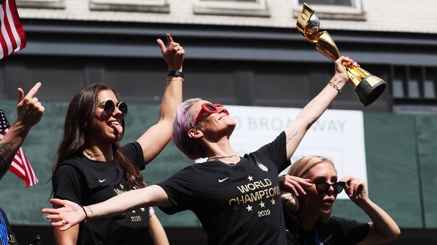 NEW YORK, NEW YORK - JULY 10: Alex Morgan, Megan Rapinoe, and Allie Long celebrate during the U.S. Women's National Soccer Team Victory Parade and City Hall Ceremony on July 10, 2019 in New York City. (Photo by Al Bello/Getty Images)