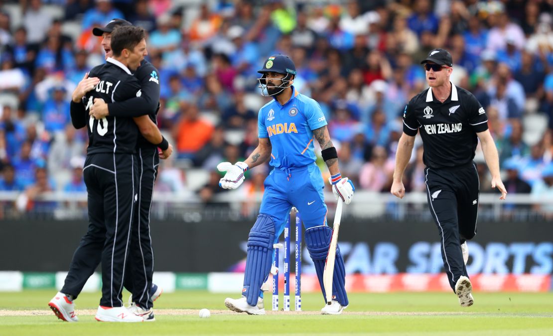 Trent Boult of New Zealand celebrates bowling Virat Kohli of India lbw.