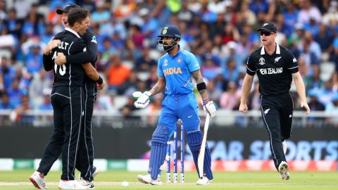Trent Boult of New Zealand celebrates bowling Virat Kohli of India lbw.