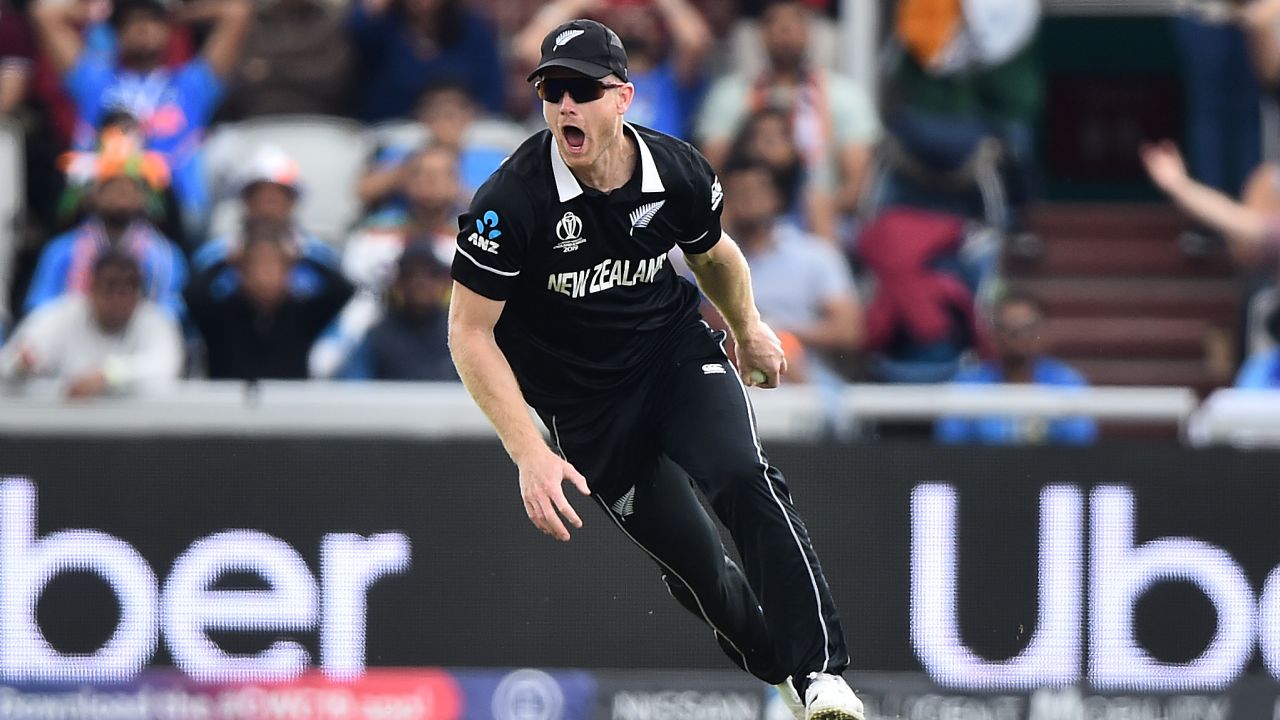Jimmy Neesham catches Dinesh Kartik as New Zealand takes control at Old Trafford.