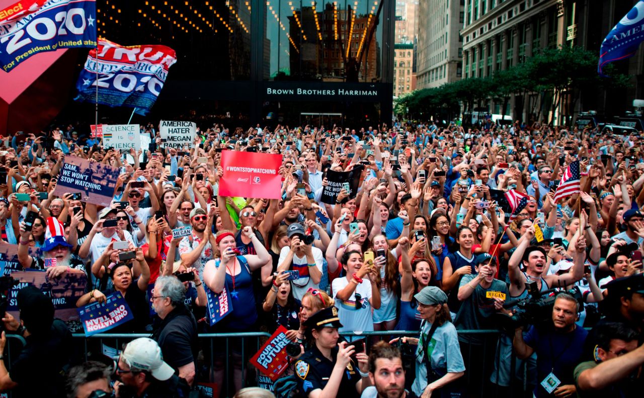 Fans cheer as members of the US women's national team parade down the streets of New York. 