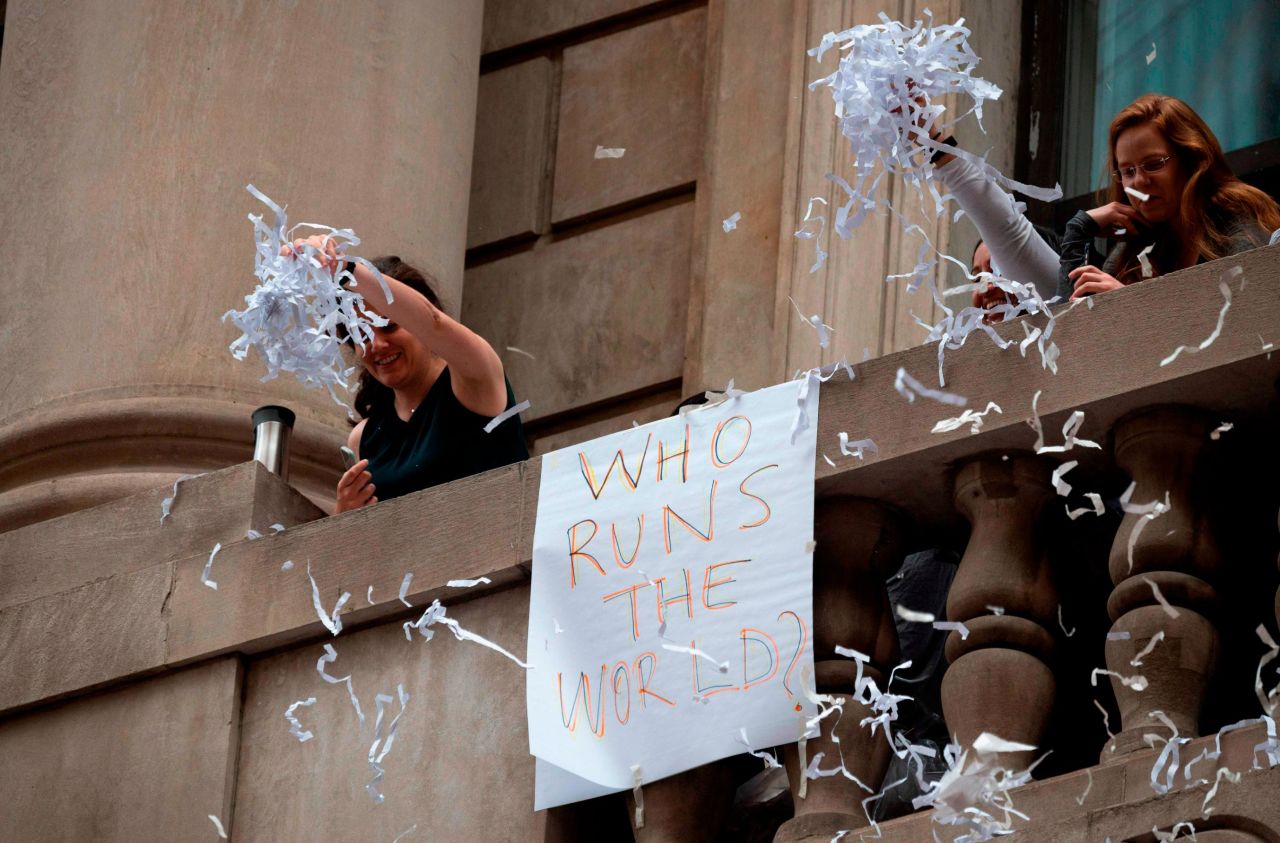 Fans throw ticket tape during the Women's World Cup championship parade.
