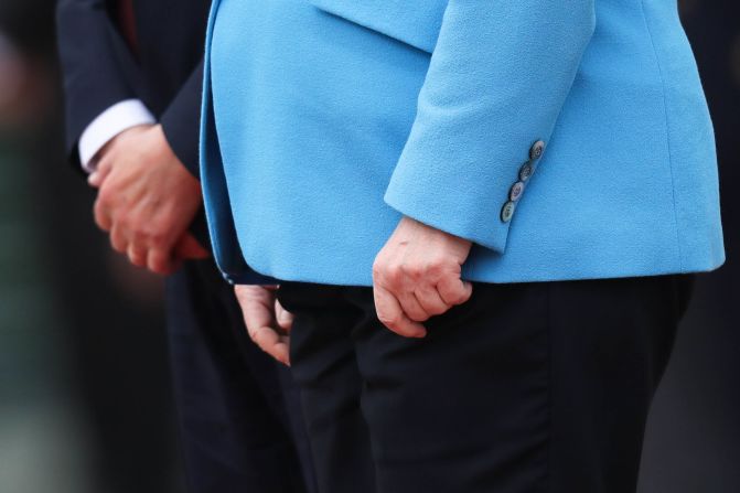 The hands of Merkel and Finnish Prime Minister Antti Rinne are seen as they listen to national anthems in Berlin in July 2019. Merkel's body <a href="index.php?page=&url=https%3A%2F%2Fedition.cnn.com%2F2019%2F07%2F10%2Feurope%2Fangela-merkel-shaking-third-time-grm-intl%2Findex.html" target="_blank">visibly shook again,</a> raising concerns over her health. She said she was fine and that she has been "working through some things" since she was first seen shaking in June.