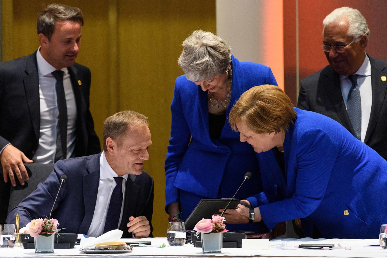 Merkel talks with European Council President Donald Tusk and British Prime Minister Theresa May at a roundtable meeting in Brussels, Belgium, in April 2019. May was in Brussels to formally present her case for a short Brexit delay.